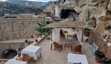 an outdoor dining area with tables and chairs