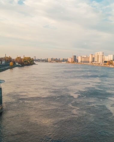 a large body of water next to a city