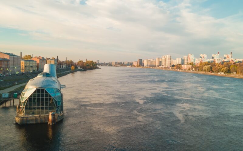 a large body of water next to a city