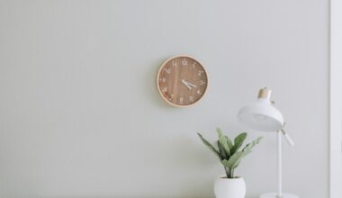 white desk lamp beside green plant