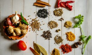 a variety of spices on a white table