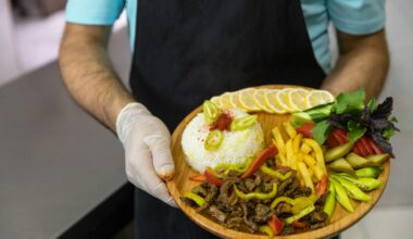 person holding brown round plate with burger